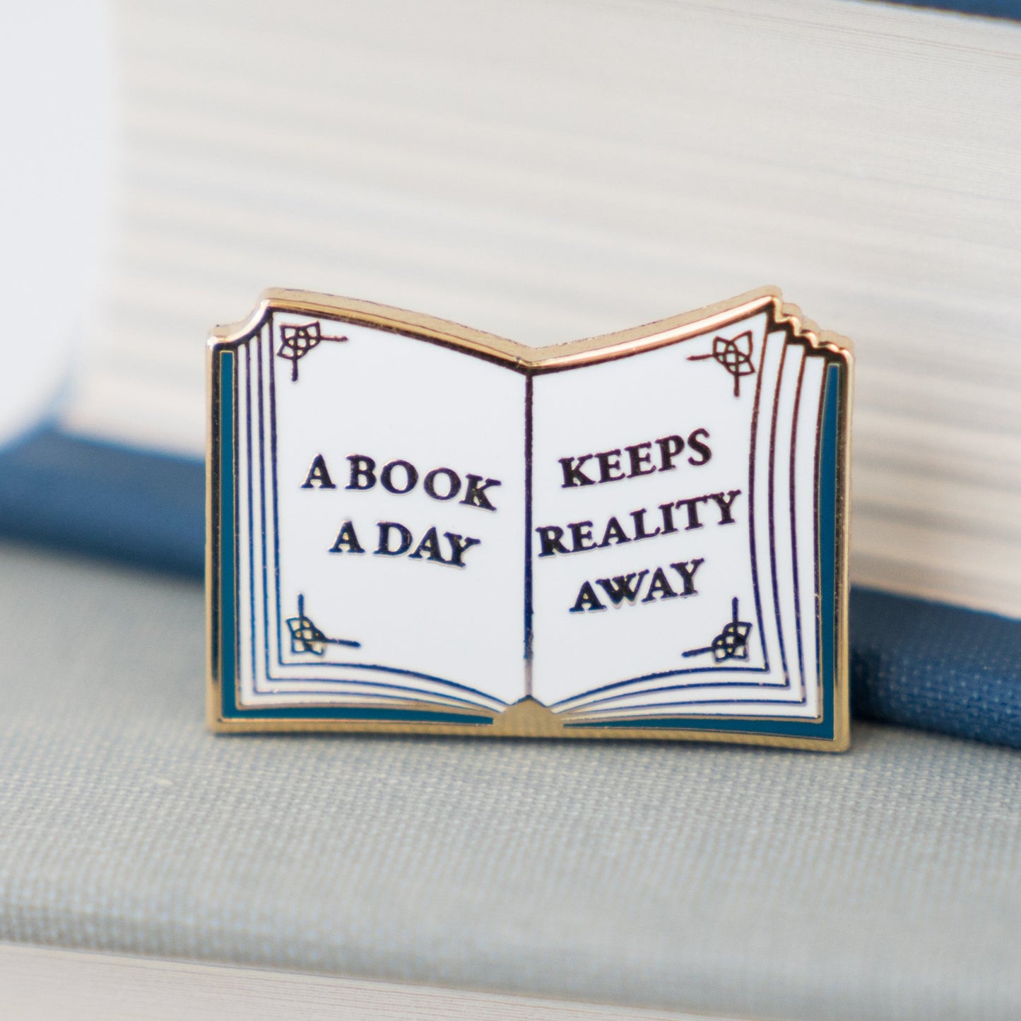 A Book a Day Keeps Reality Away Enamel Pin